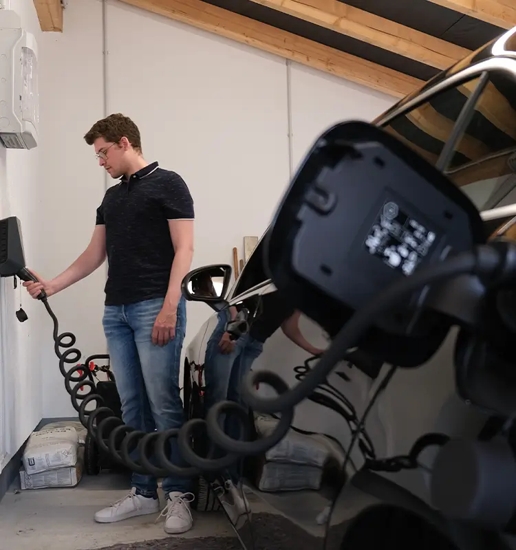 A Man is charging his EV
